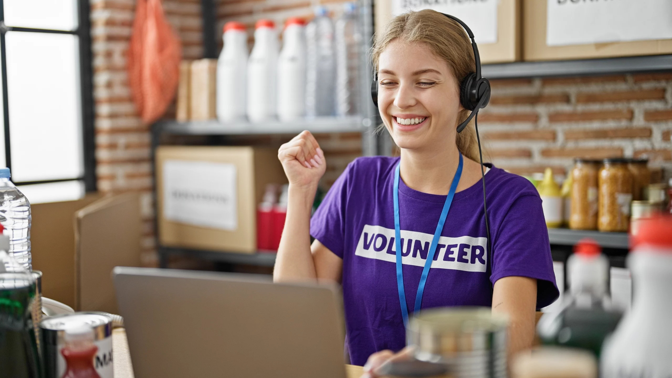 volunteer setting up direct debit; why organisations need a charity direct debit system | Biz Core
